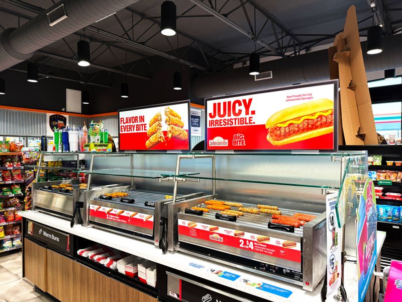 Convenience store hot food program featuring roller grills, food merchandising, grab-and-go options, and customer-facing foodservice displays.