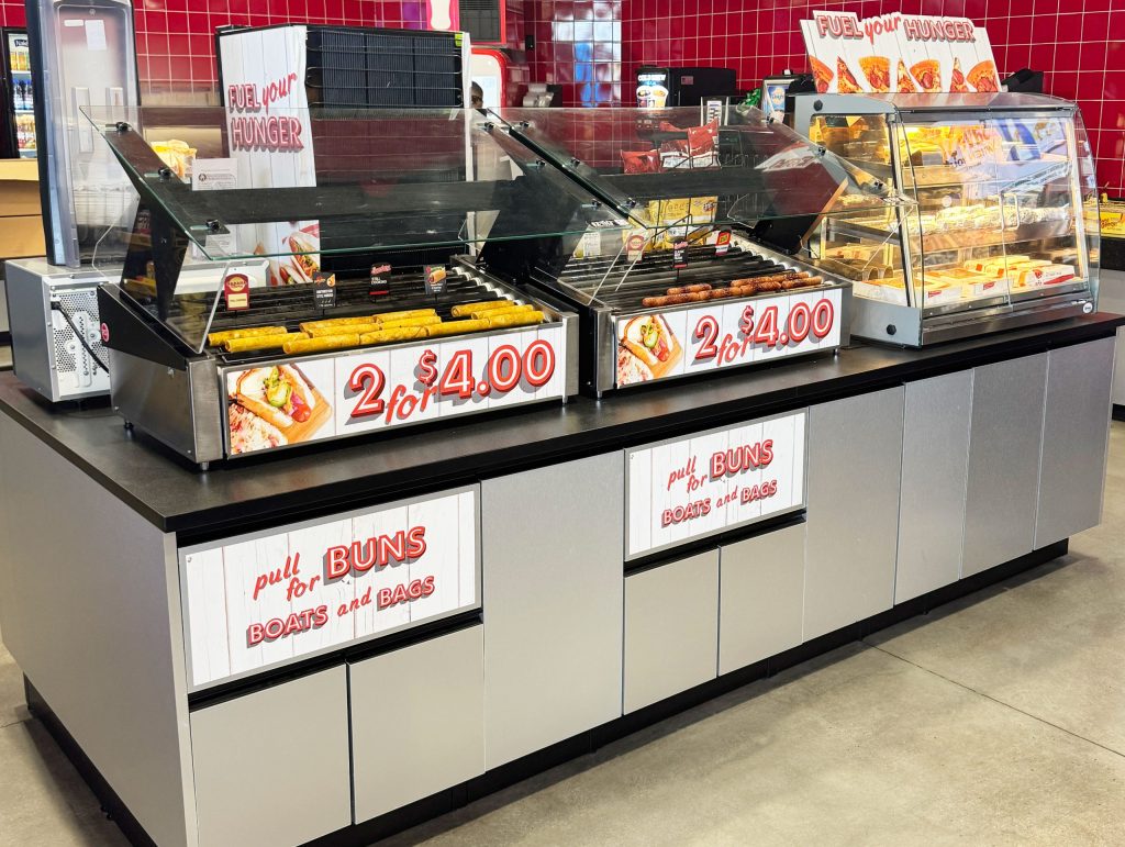 Roller grill foodservice setup with multiple grills and hot food merchandising
