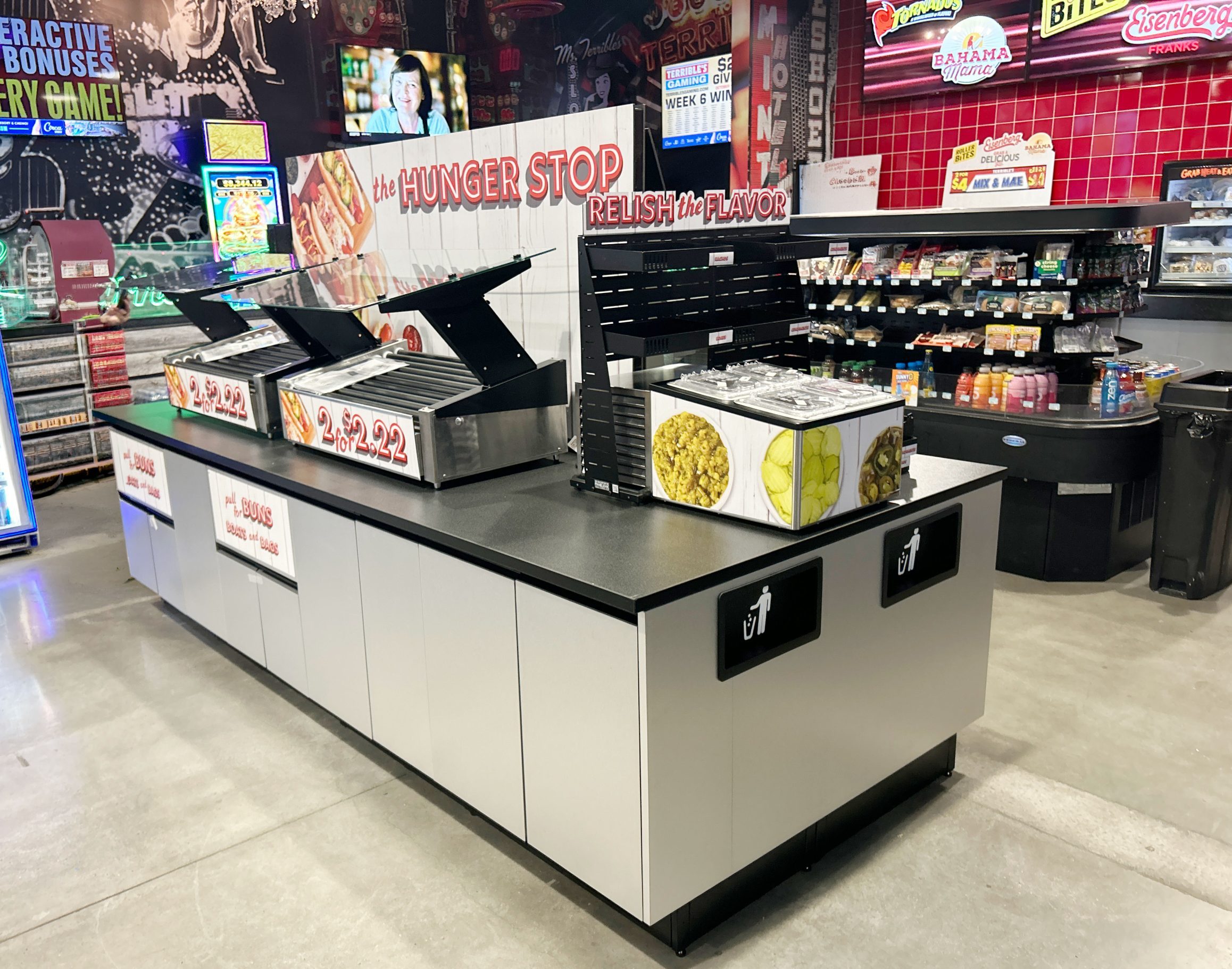 Integrated convenience store roller grill program with EZ-Tilt™ Sneeze Guard, bun storage and PanelRak™ merchandising